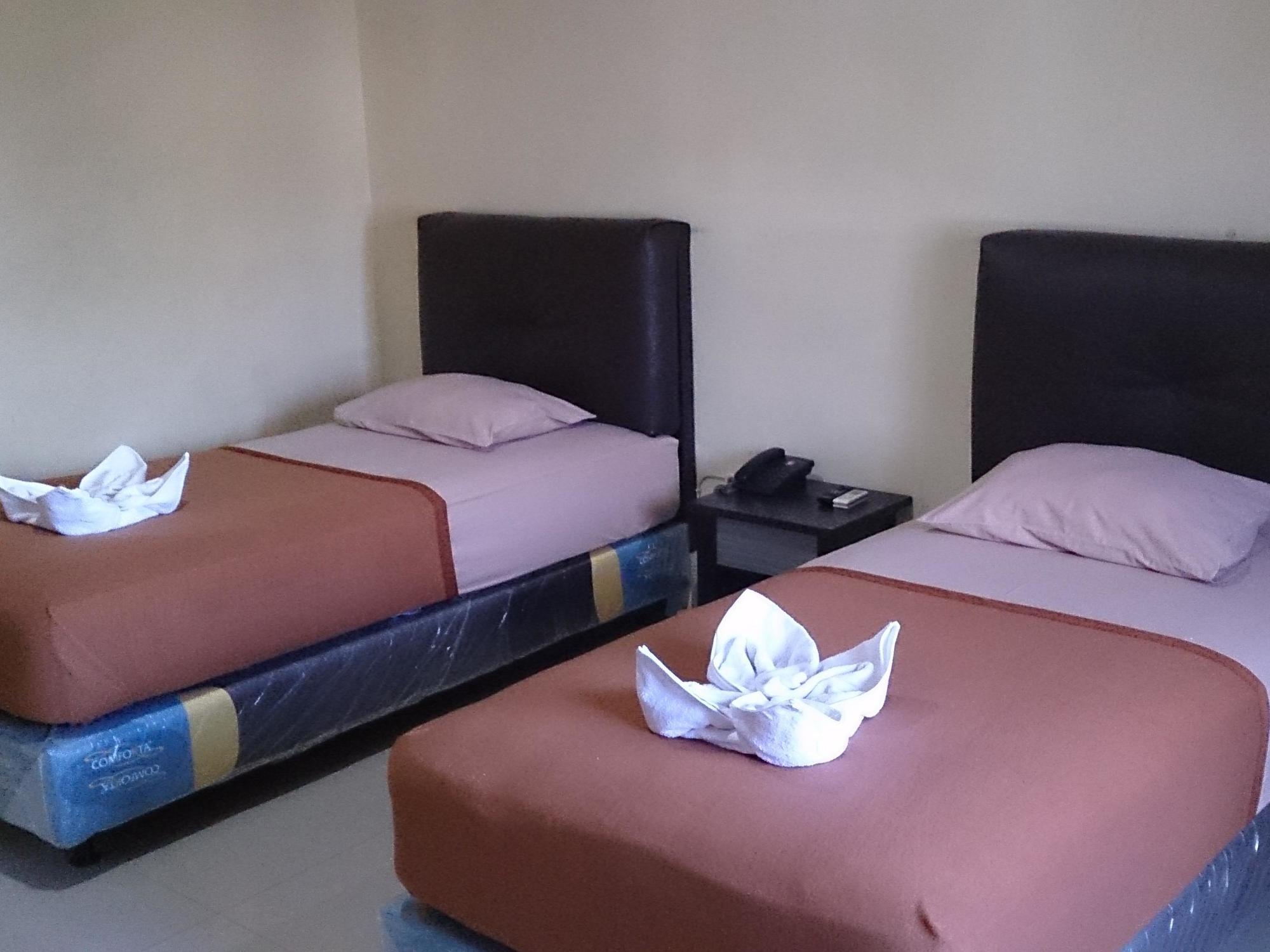 Quint Hotel Manado Esterno foto